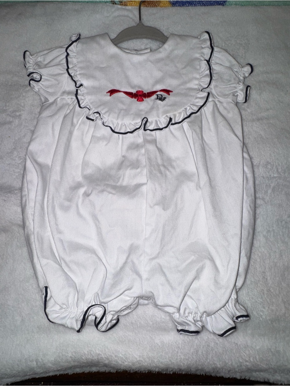 Baby Dior White Kids One-Piece with Red Embroidery & Navy Ruffle Details